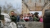 Ukraine -- Local citizens stand in line at the checkpoint controlled by pro-Russian rebels on the Severskiy Donets riverside in the settlement of Stanytsia Luhanska of Luhansk region, October 9, 2016