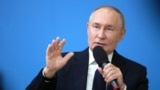 Russian President Putin delivers a lesson at Kyzyl school